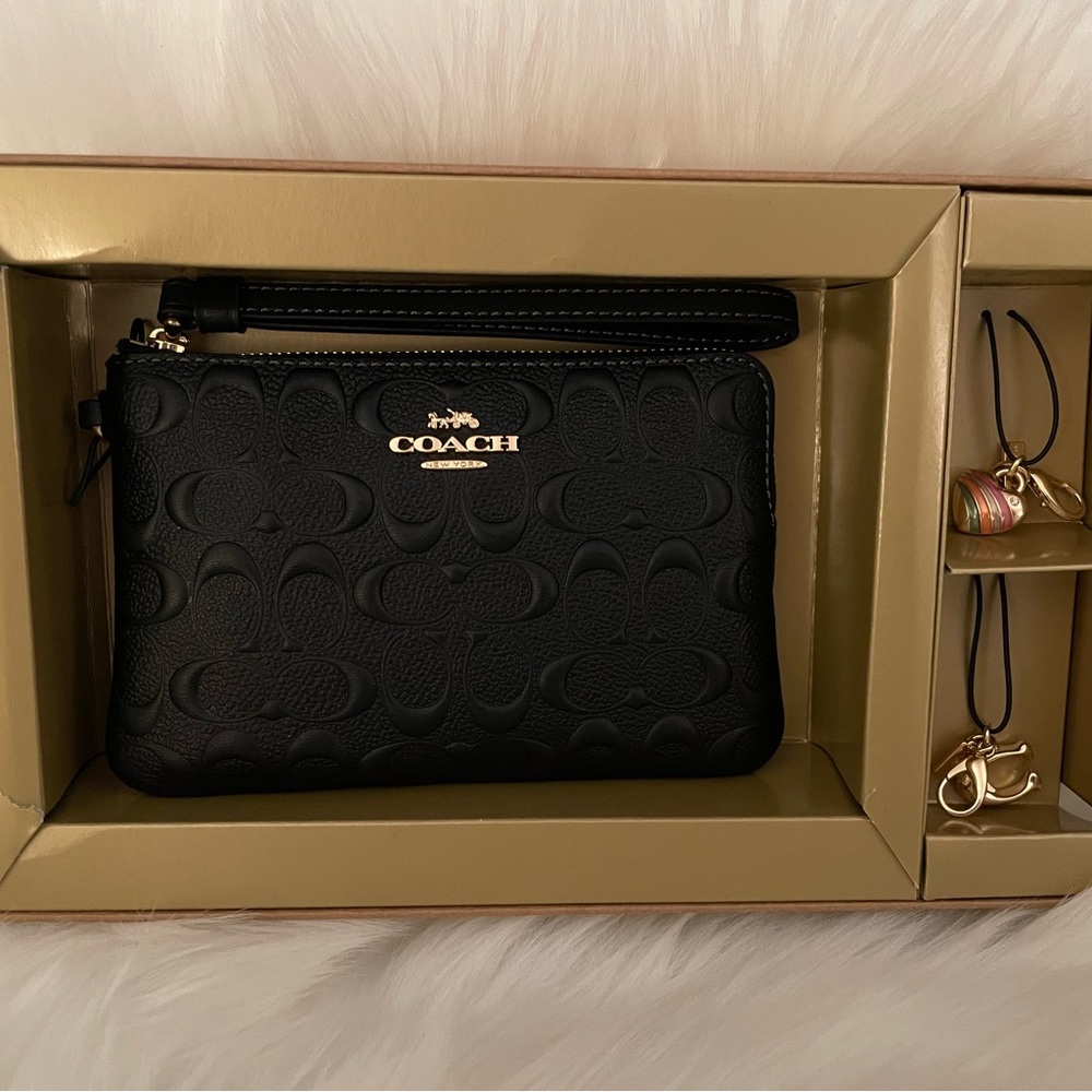 Coach Wristlet- Black- Embossed Monogram- With Two Charms-NWT- In Original Box.
